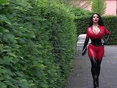 Sexy big boobed in red latex suit