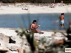 Curvy naked amateur rubs in tanning oil at the beach